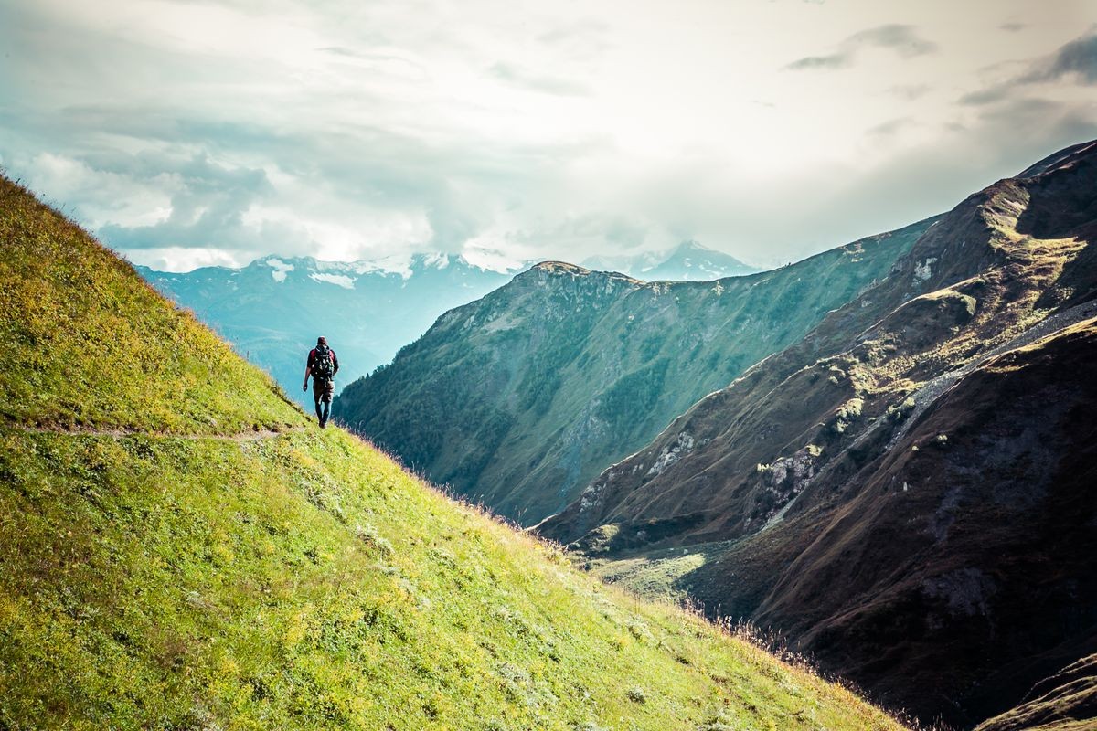 Amazing view to Caucasus Mountains. Adorable high mountain peaks in 
thick and dark cumulus clouds. 
Village in the mountain valley. Svaneti, Geogria.