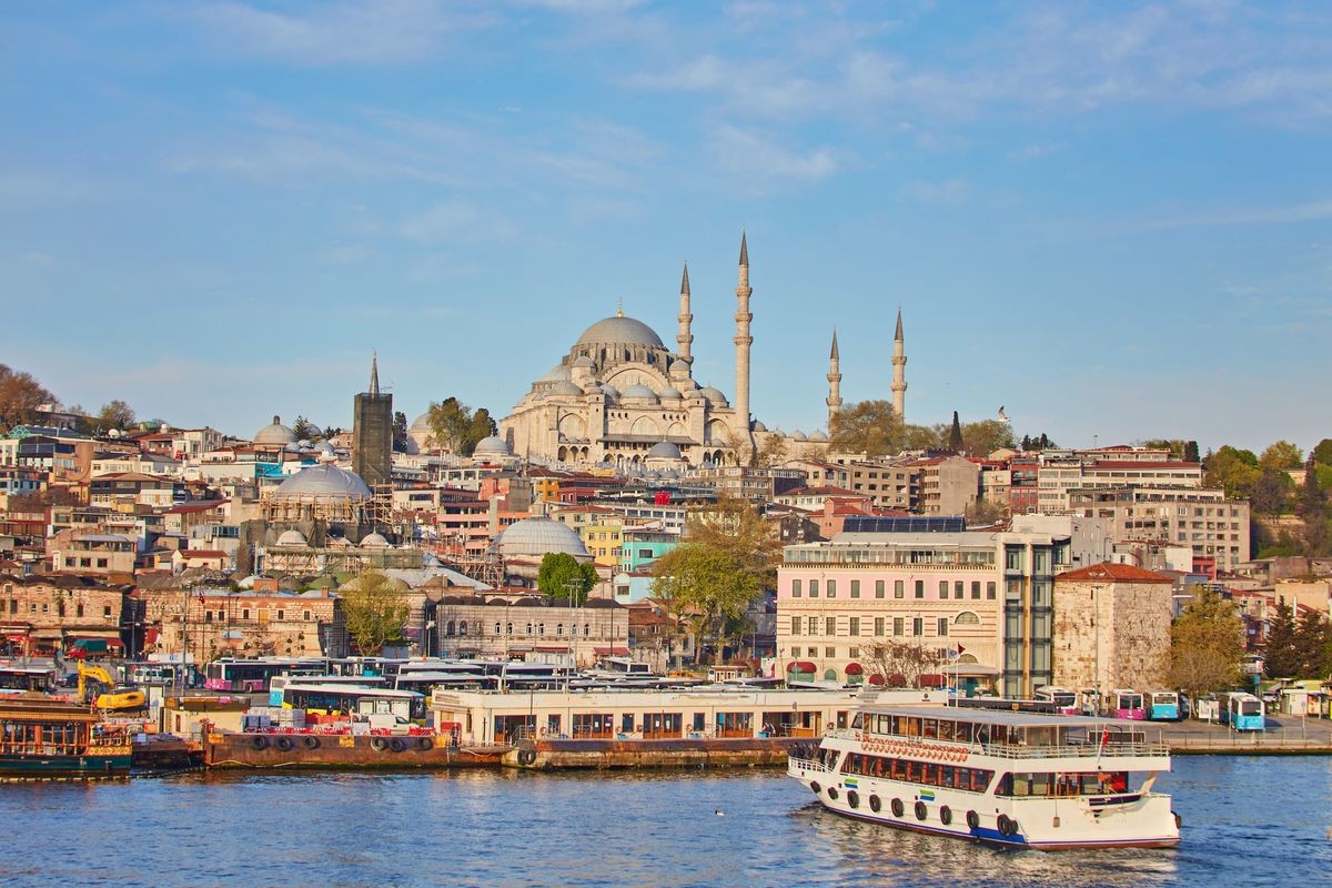 Istanbul cityscape with boats and Suleymaniye Mosque, Turkey.